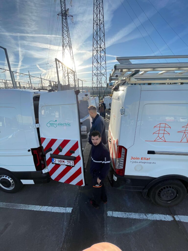 Elia technicians with new electric utility vehicles